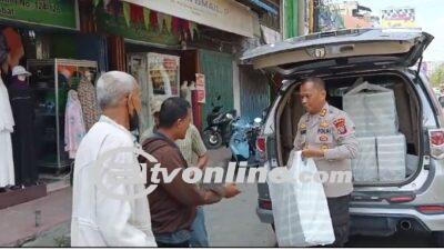 Ketua Yayasan Grand Fansuri AKBP Dr. JHS. TANJUNG, MH Yang juga Selaku Pimpinan Umum Media Bitv Berbagi Santunan di Kecamatan Stabat